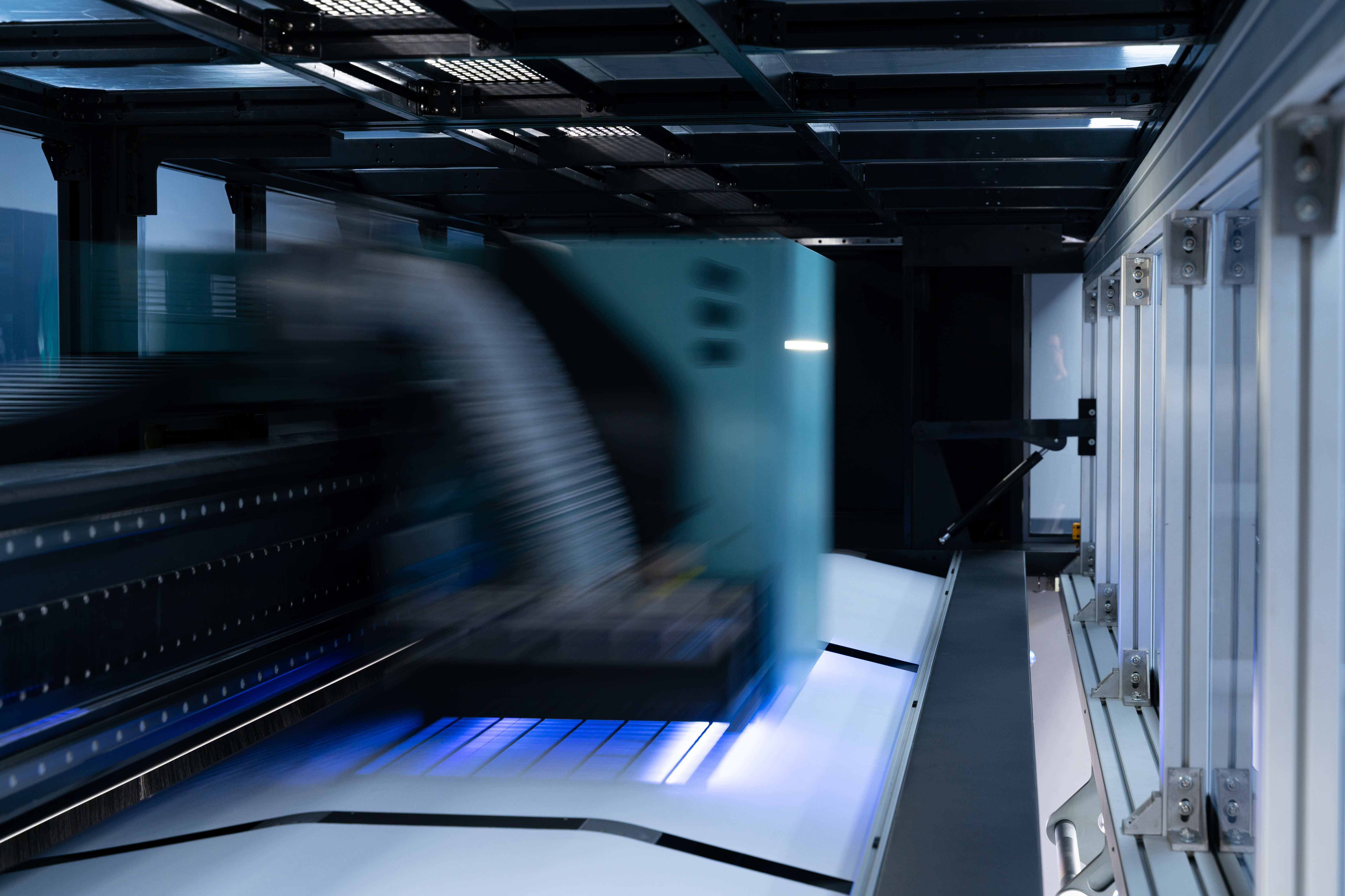 High-speed industrial printer producing a large-format print