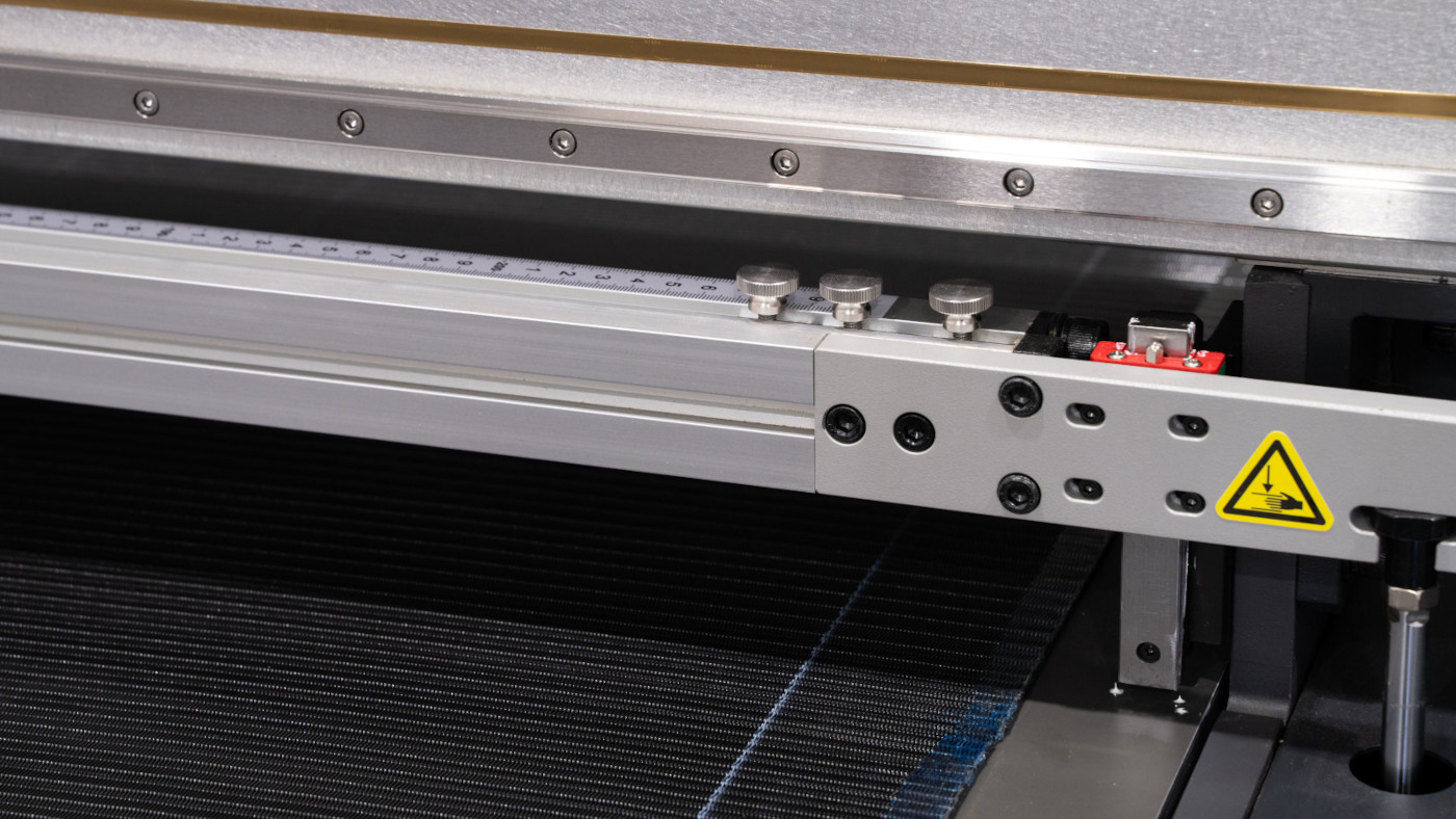 Close-up of printer with a yellow warning label.