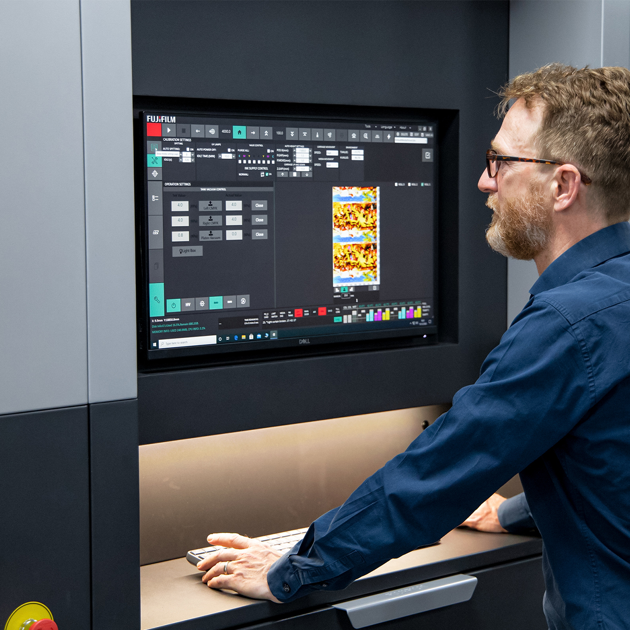 A person reviewing colorful print samples.