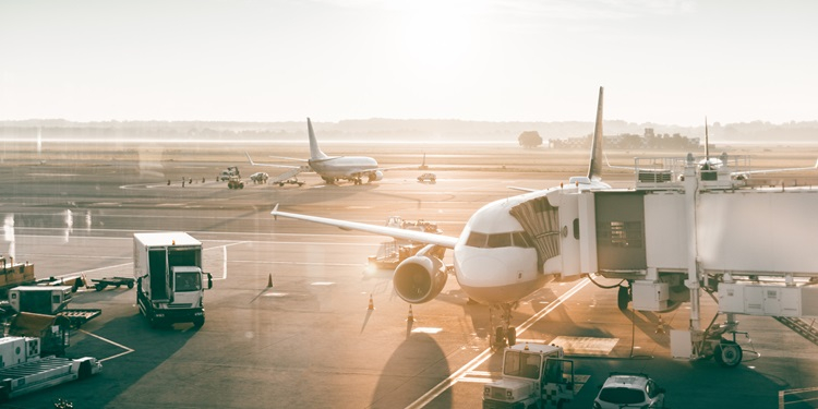 The scene of an airplane unloading cargo.