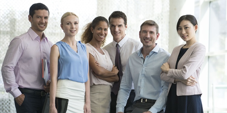 Six smiling business people.