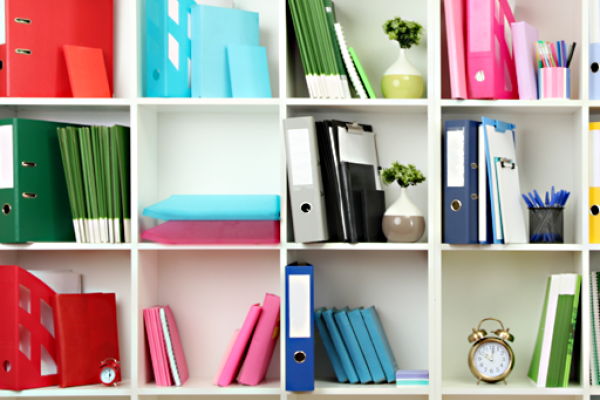 Colorful documents on bookshelf