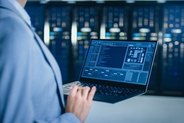 man working in a data centre