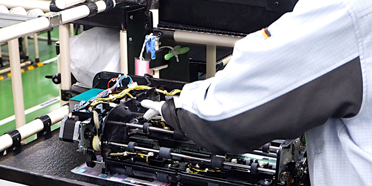 Employees working on the manufacturing floor.